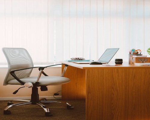Man working at desk with ergonomic posture
